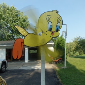YELLOW BIRD FLYING