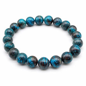 May include: A stretch bracelet composed of round, polished beads featuring a vibrant mix of deep teal, bright turquoise, and dark brown mottled patterns. The beads are strung together in a circular formation, showcasing a smooth, glossy finish.