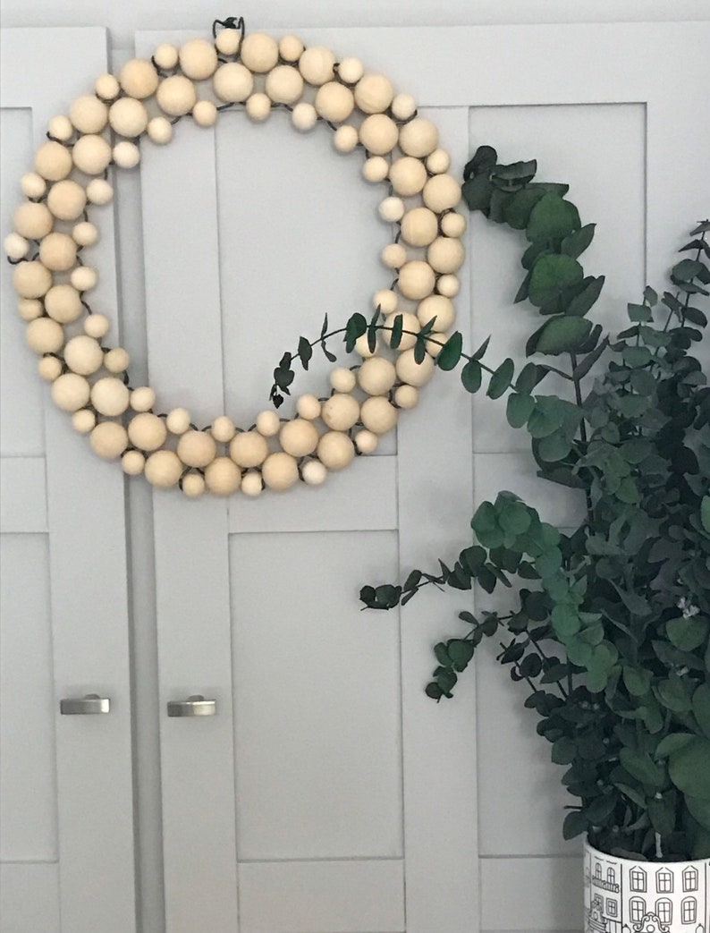 Solid, round, wood bead wreath 13 Inches