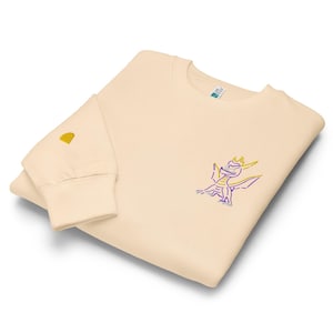 Unisex premium crew neck sweatshirt. Spyro the dragon embroidery on the left chest, gem on the right wrist.