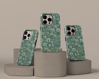 May include: Three phone cases with a dandelion pattern. The cases are green with white dandelion flowers and yellow accents. The cases are displayed on a neutral background, showcasing the design and style of the phone accessories.