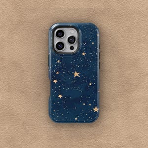 May include: A navy blue phone case with a starry night design. The case features a pattern of gold stars and white dots against a dark blue background. The phone case has a camera cutout and side buttons.