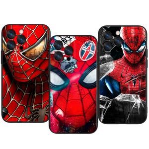 May include: Three phone cases featuring Spider-Man designs. The cases showcase the superhero's iconic red and black suit, with varying artistic styles. One case has a cityscape background, another has travel stickers, and the third has a cracked glass effect.