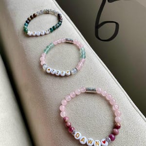 Drive-Green Moss Agate, Pietersite, and Labradorite stones 726-Moonstone, Rose Quartz, and Fluorite stones Dawn-Rose Quartz and Pink Tourmaline