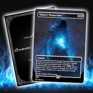 May include: A black card with the text "Teferi's Protection" and a blue spectral figure. The card has a silver border and the word "Instant" is visible. The card on the left has the word "Enchanted" in script.