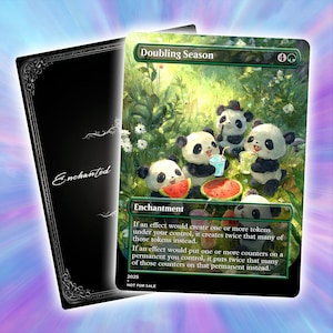 May include: A collectible card with an illustration of panda bears at a picnic, with watermelon and drinks. The card is titled "Doubling Season" and includes game text. A black card with the word "Enchanted" is visible.