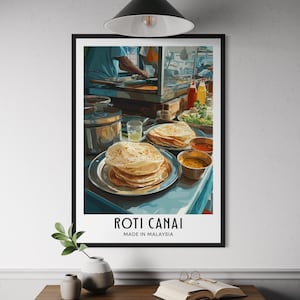Könnte beinhalten: Ein gerahmter Druck mit einer malaysischen Streetfood-Szene. Das Bild zeigt einen Stapel Roti-Canai-Pfannkuchen auf einem silbernen Teller, begleitet von kleinen Schalen mit Curry. Der Text "ROTI CANAI MADE IN MALAYSIA" ist unten zu sehen.
