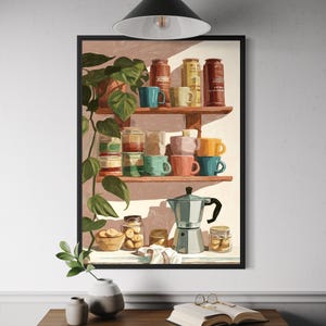 May include: A framed art print depicts a kitchen scene with shelves holding colorful mugs, jars, and a coffee maker. A potted plant and a small vase with greenery are in the foreground. The artwork has a warm, inviting aesthetic.