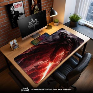 May include: A large rectangular desk mat with a detailed illustration of Darth Vader and a red lightsaber. The mat is black and red, with the text "ARTHUR DESKMAT". The mouse pad size is 60cm x 120cm.