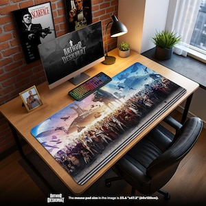 May include: A large rectangular mouse pad with a colorful fantasy battle scene. The pad, labeled "ARTHUR DESKMAT", measures 23.6" x 47.2". A computer, keyboard, and desk lamp sit on a wooden desk. Movie posters and a framed photo are visible.