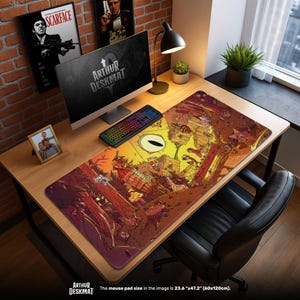 Pode incluir: Um tapete de mesa retangular grande com uma ilustração de desenho animado colorida. O tapete apresenta um design vibrante com um motivo de olho central e vários personagens de desenho animado. O texto "ARTHUR DESKMAT" é visível. O tapete mede 60cm x 120cm.