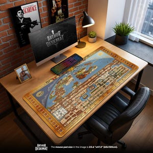 May include: A large rectangular desk mat with a world map design. The mat is primarily blue and brown with a gold border. The text "ARTHUR DESKMAT" is visible. The mouse pad size is 23.6" x 47.2".