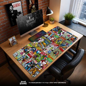May include: A rectangular desk mat featuring a collage of vintage comic book covers. The mat displays various superheroes and comic book titles in vibrant colors. The text "ARTHUR DESKMAT" is visible. The mouse pad size is 23.6" x 47.2".