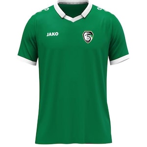 Op de afbeelding: Een groen voetbalshirt met een witte kraag en manchetten. Het shirt heeft de merknaam "JAKO" op de borst en een teamembleem aan de linkerkant. Het heeft een V-hals en is gemaakt van een gladde stof.