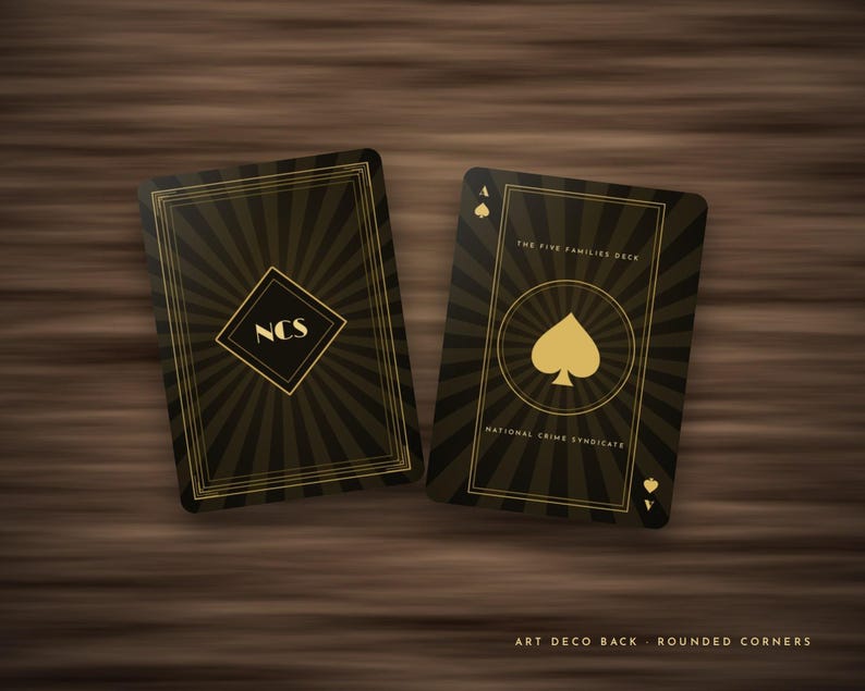 May include: Two playing cards with a black and gold sunburst design. The left card features a diamond shape with the letters NCS. The right card displays a spade symbol, the text The Five Families Deck, and National Crime Syndicate.