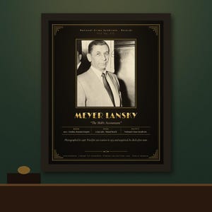 May include: A framed black and white portrait of Meyer Lansky with gold text detailing his life, including the name Meyer Lansky, the title The Mob's Accountant, and biographical data such as birth, death, and his role in the National Crime Syndicate.