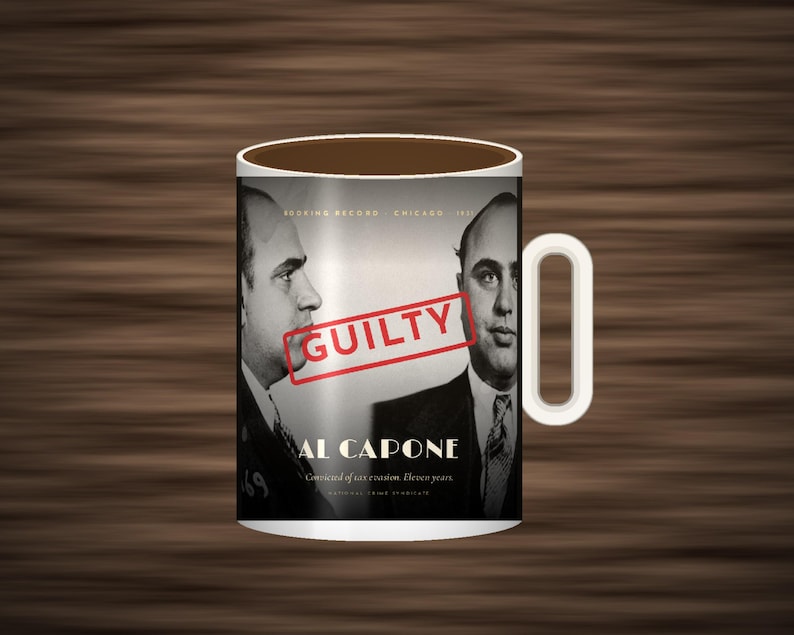 May include: A white ceramic mug featuring a black and white mugshot of Al Capone in profile and front view. The text reads Booking Record Chicago 1931, Al Capone, Convicted of tax evasion. Eleven years, National Crime Syndicate, and a red stamp GUILTY.