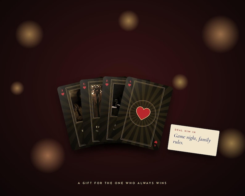 May include: Four playing cards with a dark, sunburst-patterned background and a red heart symbol. A small rectangular card displays the text: "DEAL HIM IN Game night, family rules." Below, the text reads: "A GIFT FOR THE ONE WHO ALWAYS WINS."