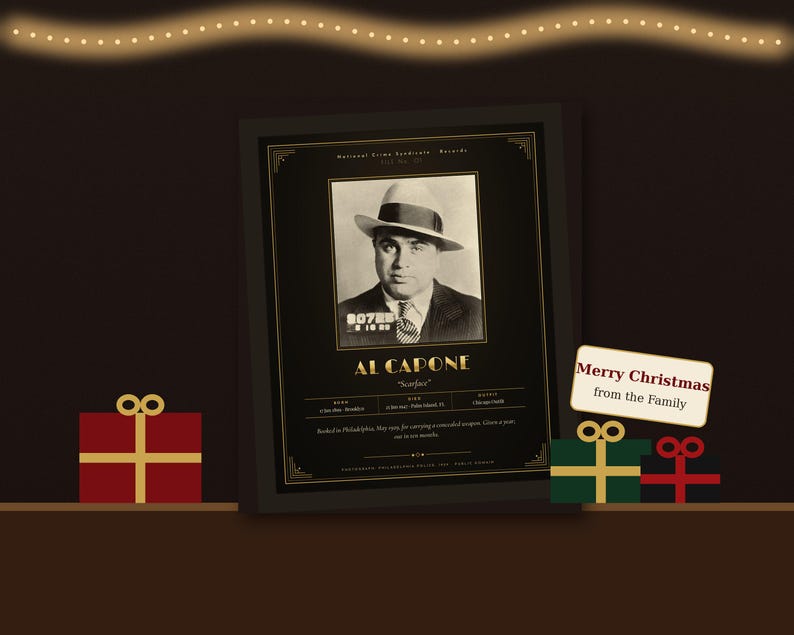 May include: A framed black and gold poster featuring a vintage mugshot of Al Capone with the text Al Capone Scarface and Merry Christmas from the Family. The design includes biographical details and a decorative border on a dark background.