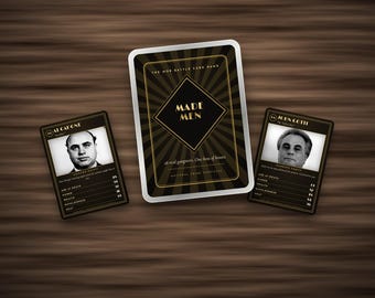 May include: A card game set titled Made Men featuring a central box with black and gold sunburst graphics, flanked by two character cards displaying black and white portraits of Al Capone and John Gotti with printed statistics and biographical text.