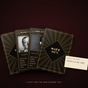 May include: A set of black and gold playing cards titled Made Men featuring historical figures like Frank Costello and Vito Genovese. The cards display statistics for age at death, power, wealth, ruthlessness, and heat. A small white card reads Who's the boss? Settle it at the table.