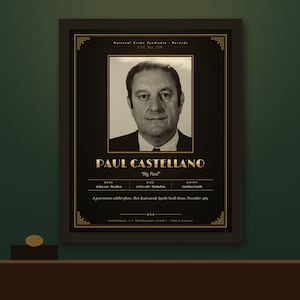 May include: A framed black and gold poster featuring a portrait of Paul Castellano, titled "Big Paul." The text includes "National Crime Syndicate Records," birth and death dates, and a note about his death outside Sparks Steak House.