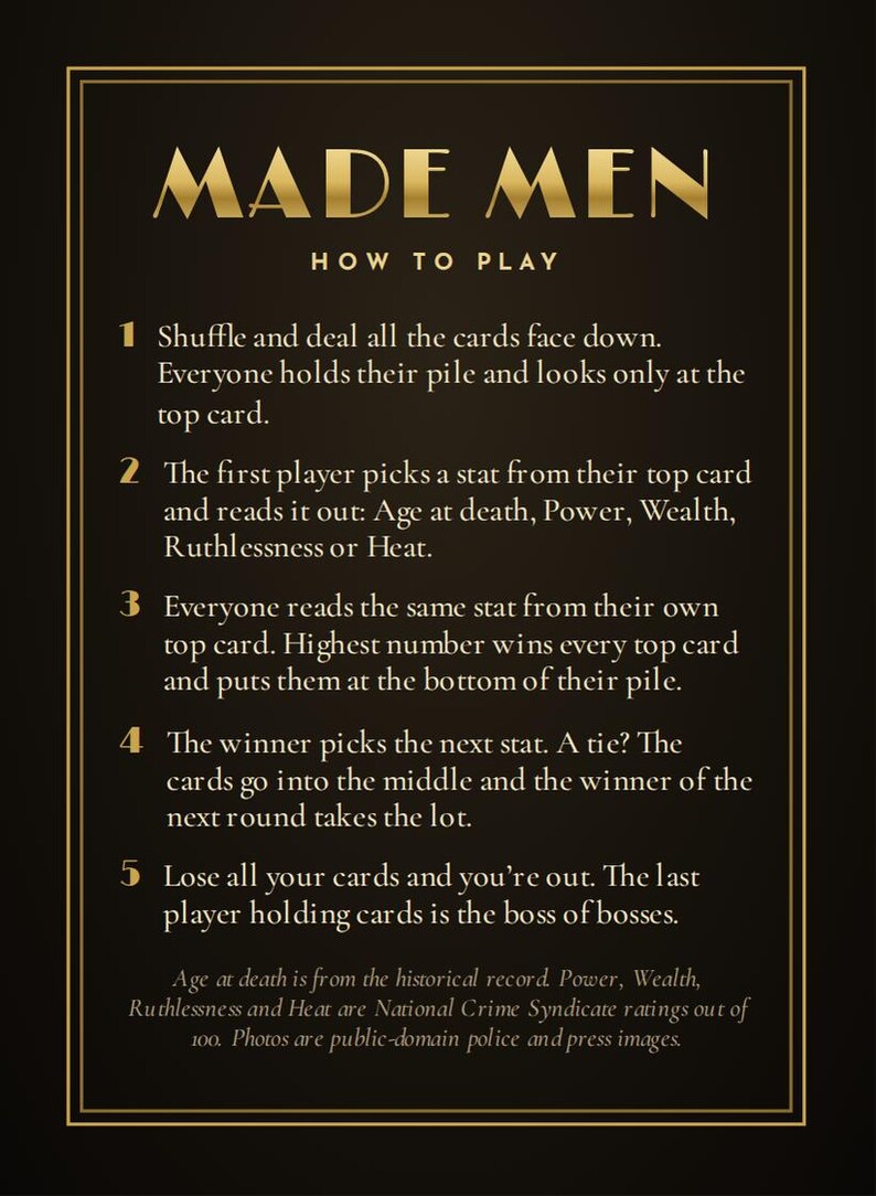 May include: A black instructional card for the game Made Men with gold text and borders. It lists five numbered steps for gameplay, explaining how to shuffle, deal, compare stats like Age at death, Power, Wealth, Ruthlessness, and Heat.