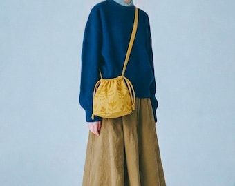 Cotton bucket bag in mustard yellow. Vegan handbag made from hand screenprinted cotton.