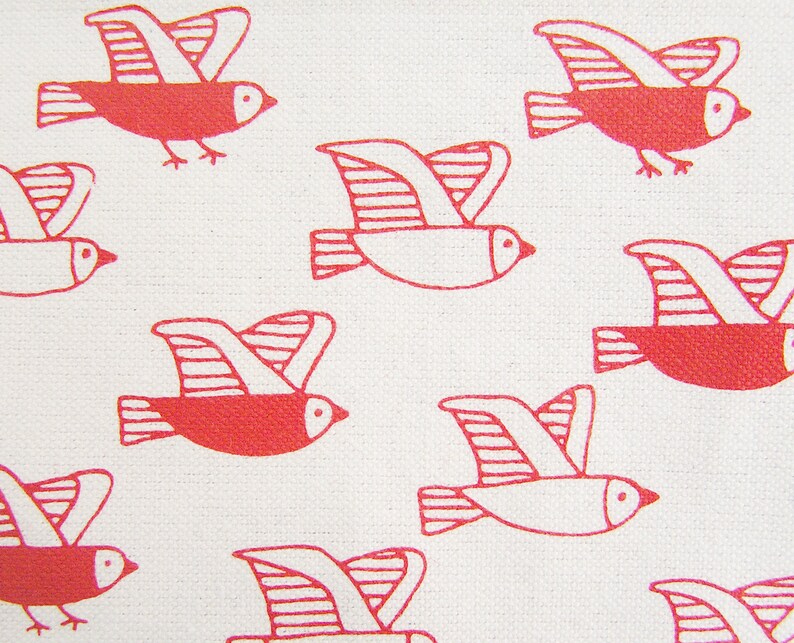 May include: A white background with a pattern of red flying birds. The birds are stylized and have a simple design.