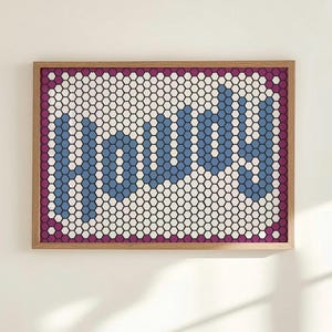 May include: A framed artwork spelling "FOCUS" in blue, white, and black hexagonal tiles. It features a purple border and a natural wood frame. The design is modern and geometric, suitable for various interior styles.