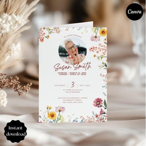 May include: A memorial card with a floral design and the text "In Loving Memory." It features a photo of a woman, the name "Susan Smith," and dates. The card also includes the date, time, and location of the memorial service.