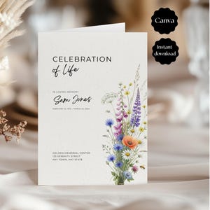 May include: A folded memorial service programme on textured white paper featuring the text Celebration of Life, In Loving Memory, Sam Jones, February 15, 1975 - March 22, 2025, and a watercolour illustration of colourful wildflowers and a small bee.