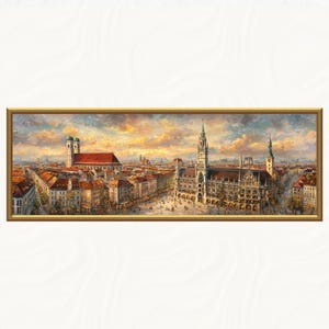 Puede incluir: Pintura panorámica enmarcada de una ciudad europea, con edificios con tejados de tejas rojas y una gran iglesia con torres gemelas. La obra de arte tiene una paleta de colores cálidos y un marco dorado, que representa un bullicioso paisaje urbano.