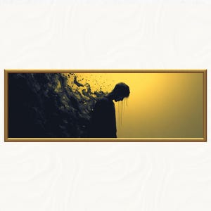 May include: A framed art print featuring a silhouette of a person with their head bowed, set against a gradient background of yellow and black. The artwork has a gold frame and a dark, abstract element on the left side.