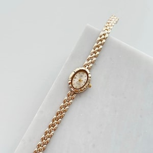 Vintage Gold Tone Oval Watch -  Elegant Stainless Steel Bracelet