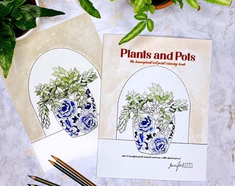 May include: A coloring book titled "Plants and Pots: The houseplant art print coloring book" by Jennifer Rizzo. The cover features a blue and white patterned pot with a green succulent plant inside. The book is open to a page with a similar illustration.