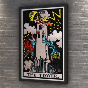 May include: Framed tarot card print of "The Tower." The image depicts a tower struck by lightning, with figures falling. The artwork features a black background, with the tower in shades of gray and the figures in red and blue. The text "THE TOWER" is at the bottom.