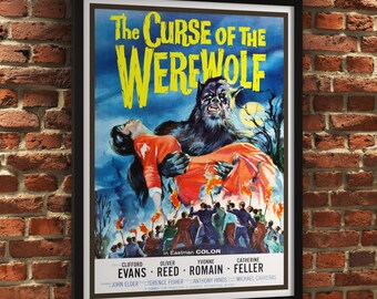 May include: Framed vintage movie poster for "The Curse of the Werewolf." The poster features a menacing werewolf holding a person in an orange dress, with a crowd of people below. The title is in large yellow letters.