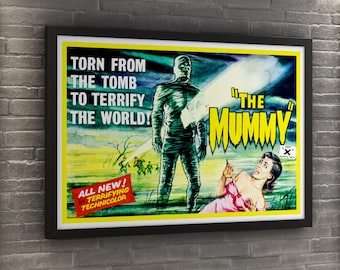 May include: Framed vintage movie poster for "The Mummy." The poster features a mummy, a woman in a pink dress, and text that reads "Torn from the Tomb to Terrify the World!" and "All New! in Terrifying Technicolor."