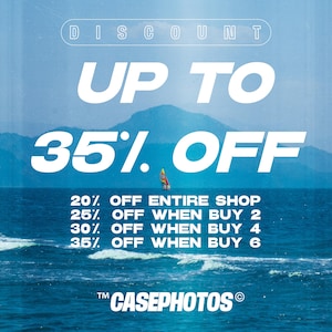 The image is a promotional poster for a sale at a shop, featuring a sailboat on the ocean and a mountain in the background.