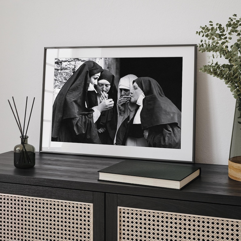 a black and white photo of a nun and a nunette