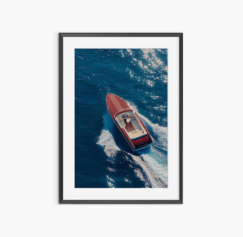 a red and blue boat in the water