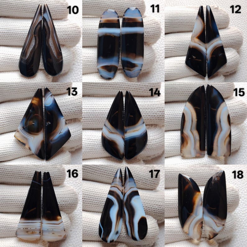 May include: A selection of paired agate gemstone cabochons in diverse shapes. The stones display black, white, brown, and blue banding patterns. Each pair is unique, showcasing natural variations in colour and design. Suitable for jewellery making.