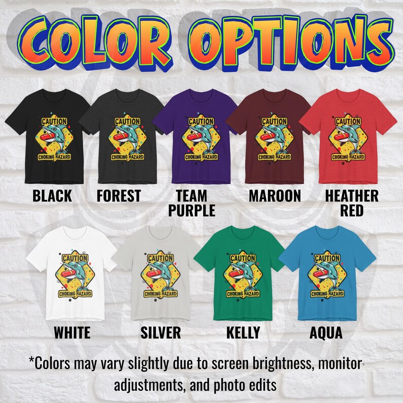 May include: A collection of nine short-sleeve t-shirts in black, forest, team purple, maroon, heather red, white, silver, kelly, and aqua. Each shirt features a graphic of a dolphin holding a red hot dog with the text CAUTION CHOKING HAZARD.