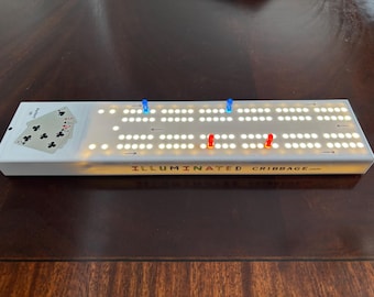 LED cribbage board that uses light to illuminate the colored pegs and scoring holes in all lighting. Great for visually impaired too