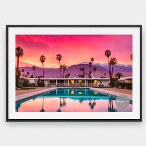 May include: A mid-century modern home with a swimming pool in the foreground. The home is surrounded by palm trees and the mountains are in the background. The sky is a vibrant pink and orange.
