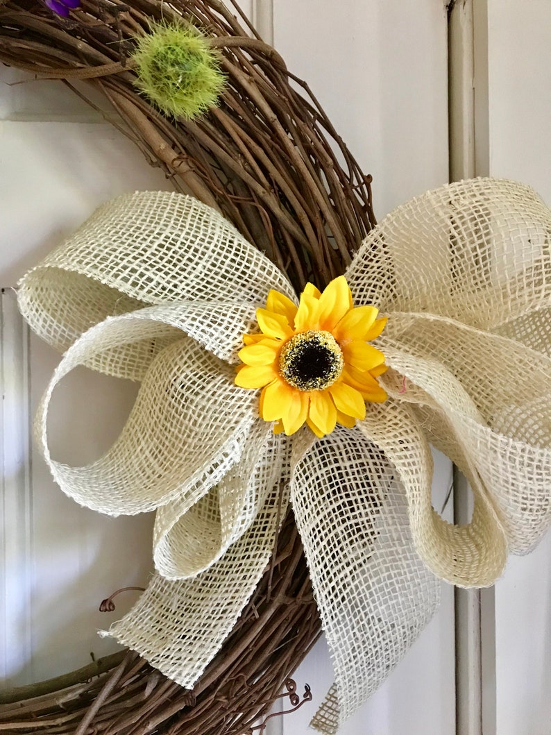 peonies and a burlap bow. Sunshine and Happiness- beautiful bright and sunny this yellow and purple grapevine wreath features sunflowers