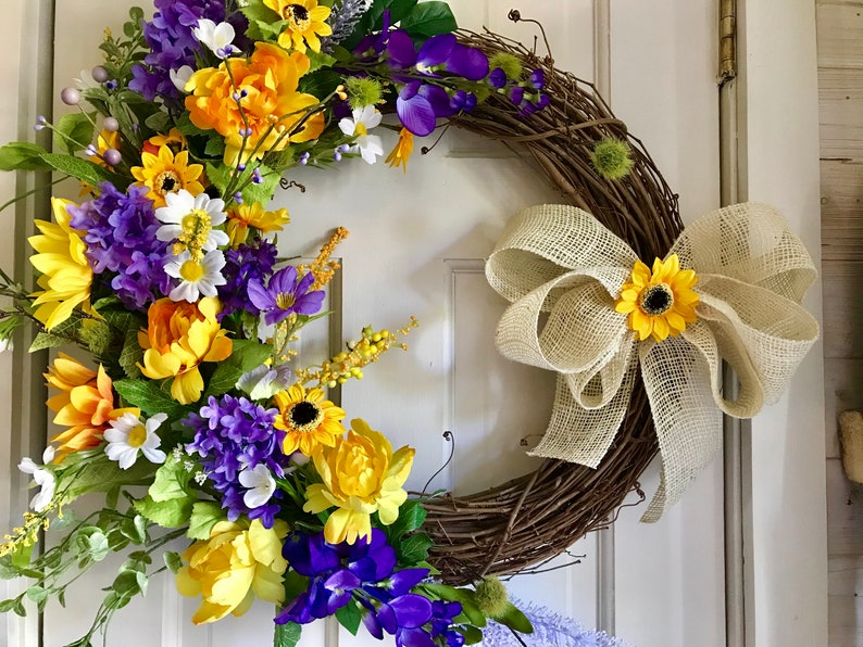 peonies and a burlap bow. Sunshine and Happiness- beautiful bright and sunny this yellow and purple grapevine wreath features sunflowers
