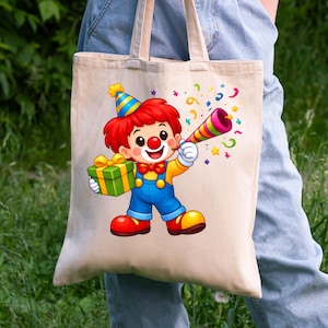 May include: A beige canvas tote bag featuring a colorful cartoon clown illustration. The clown wears a blue and yellow party hat, red hair, a red bow tie, and blue overalls. The clown holds a green gift box and a multi-colored party horn.