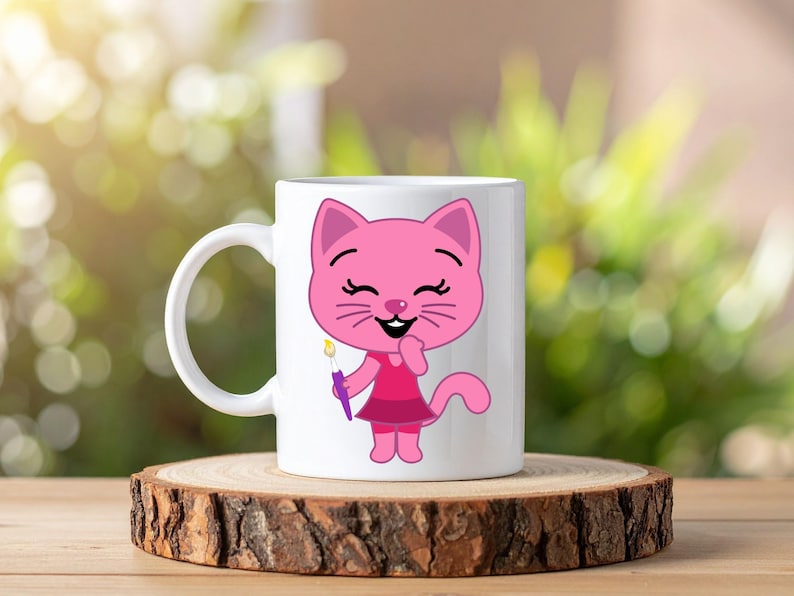 May include: A white ceramic mug featuring a cartoon illustration of a pink cat wearing a dark pink dress and holding a small paintbrush with a yellow tip. The cat has a smiling expression with closed eyes and a visible tail extending to the right.